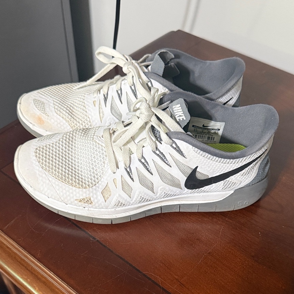 Nike Women’s White and Gray Training Sneakers with Black Swoosh